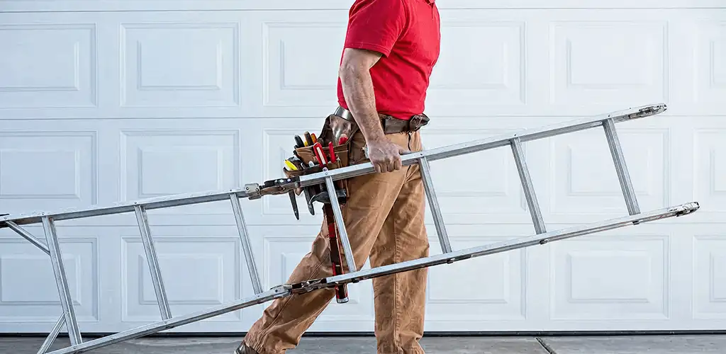Garage door repair technician arriving with tools and ladder in Dover, DE